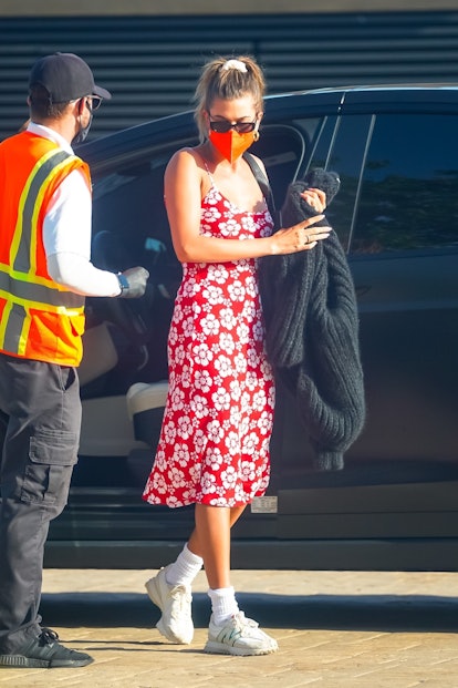 hailey bieber wears red floral em on holiday dress for dinner at nobu